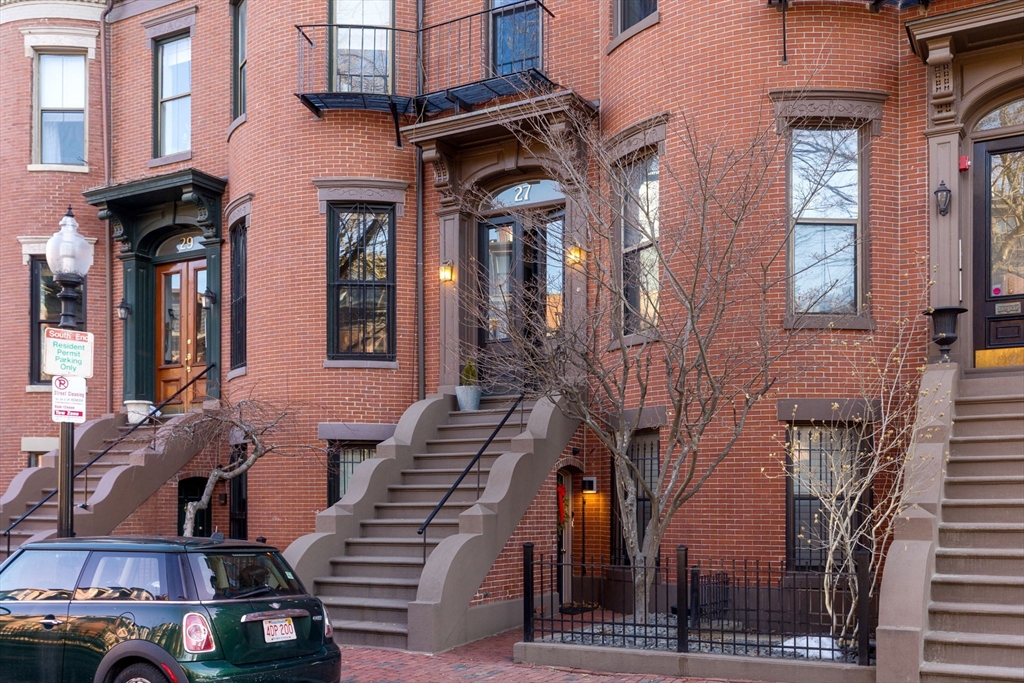 27 Concord Square, Unit 3 Boston, MA 02118 - Photo 11 of 15 a view of a building with many windows