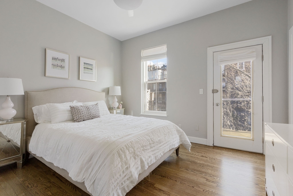 27 Concord Square, Unit 3 Boston, MA 02118 - Photo 8 of 15 a bedroom with a bed and a window