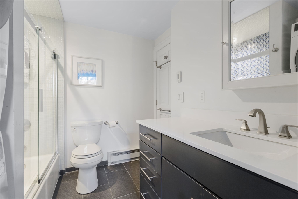 27 Concord Square, Unit 3 Boston, MA 02118 - Photo 10 of 15 a bathroom with a sink toilet and shower