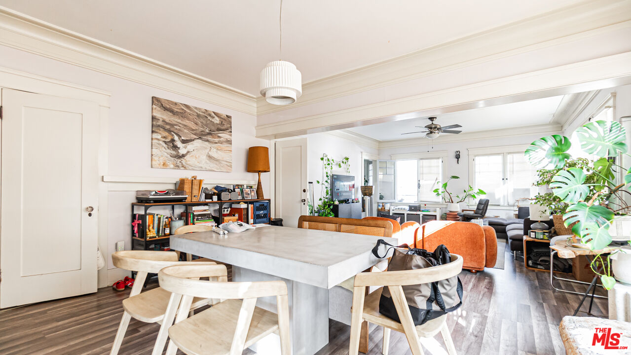 735 Locust Avenue Long Beach, CA 90813 - Photo 11 of 46 a view of a dining room with furniture a chandelier and wooden floor