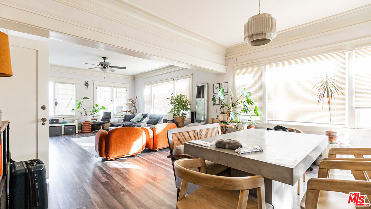 735 Locust Avenue Long Beach, CA 90813 - Photo 12 of 46 a large dining space with furniture window and wooden floor