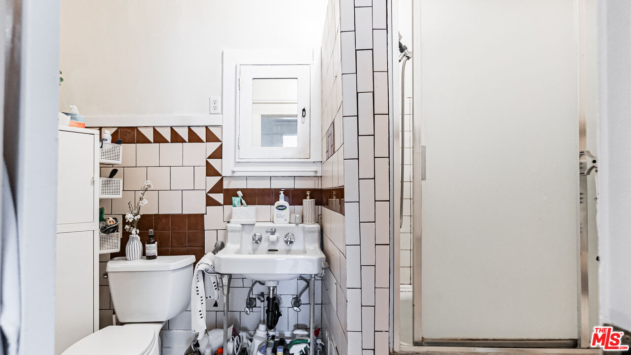 735 Locust Avenue Long Beach, CA 90813 - Photo 19 of 46 a bathroom with a sink and toilet