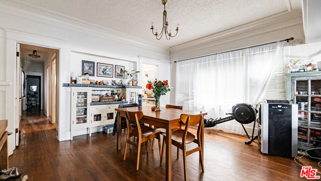 735 Locust Avenue Long Beach, CA 90813 - Photo 31 of 46 a view of a dining room with furniture and wooden floor