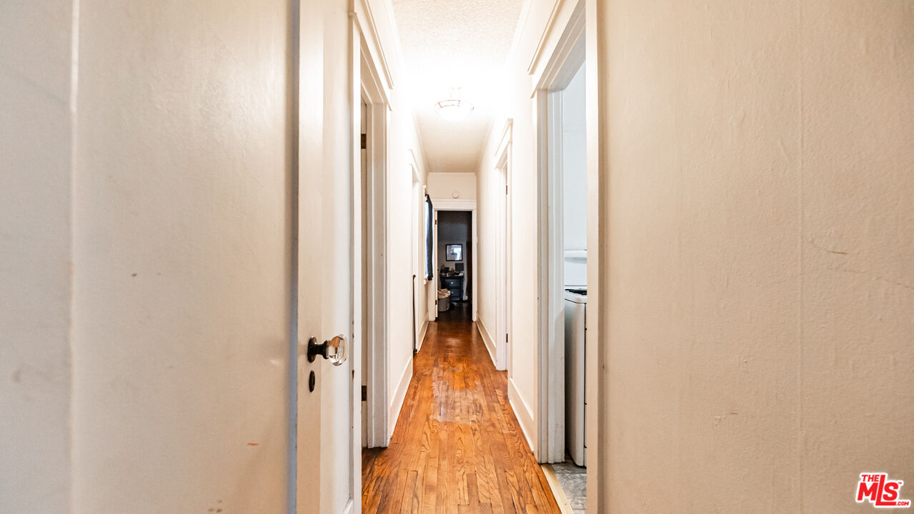 735 Locust Avenue Long Beach, CA 90813 - Photo 35 of 46 a view of a hallway with wooden floor and staircase