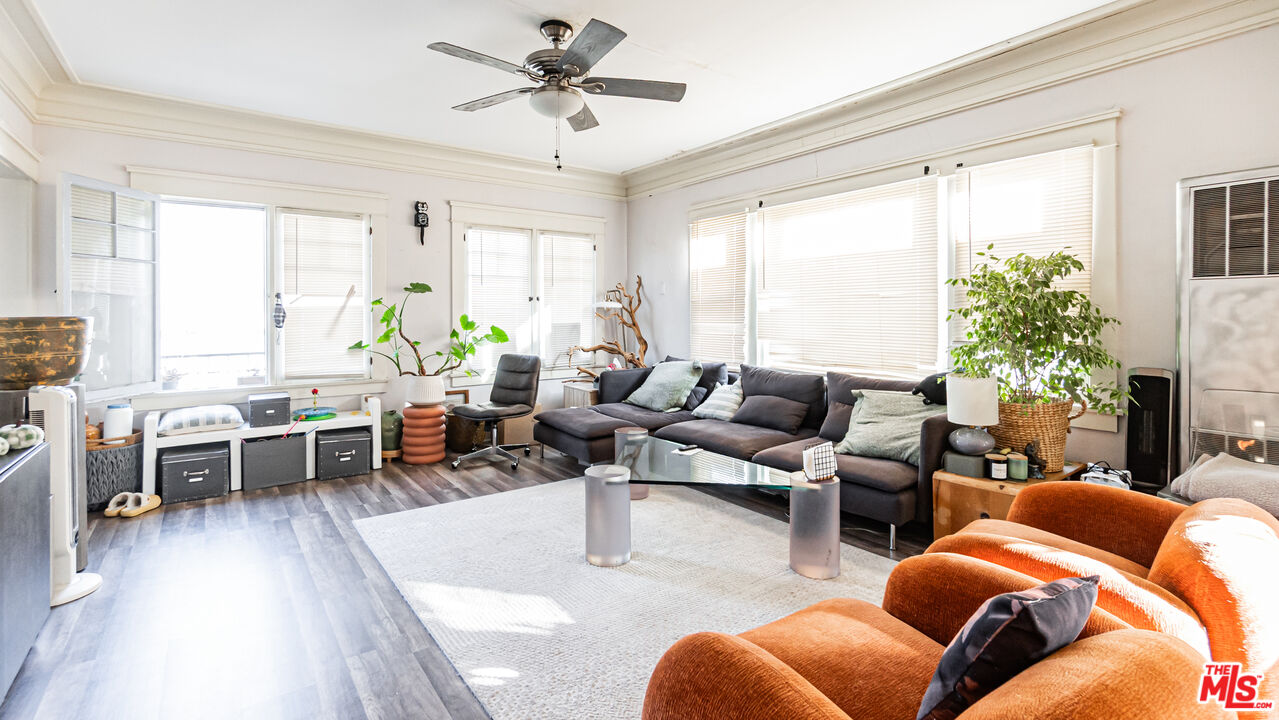 735 Locust Avenue Long Beach, CA 90813 - Photo 4 of 46 a living room with furniture a large window and a table