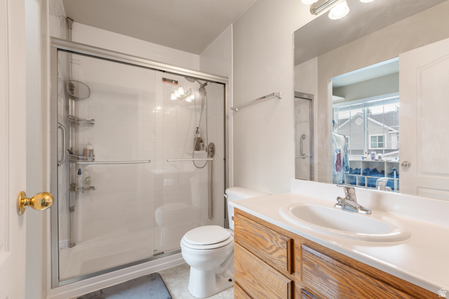 802 Brookside Court Payson, UT 84651 - Photo 24 of 32 Bathroom with vanity, a stall shower, and light tile patterned floors