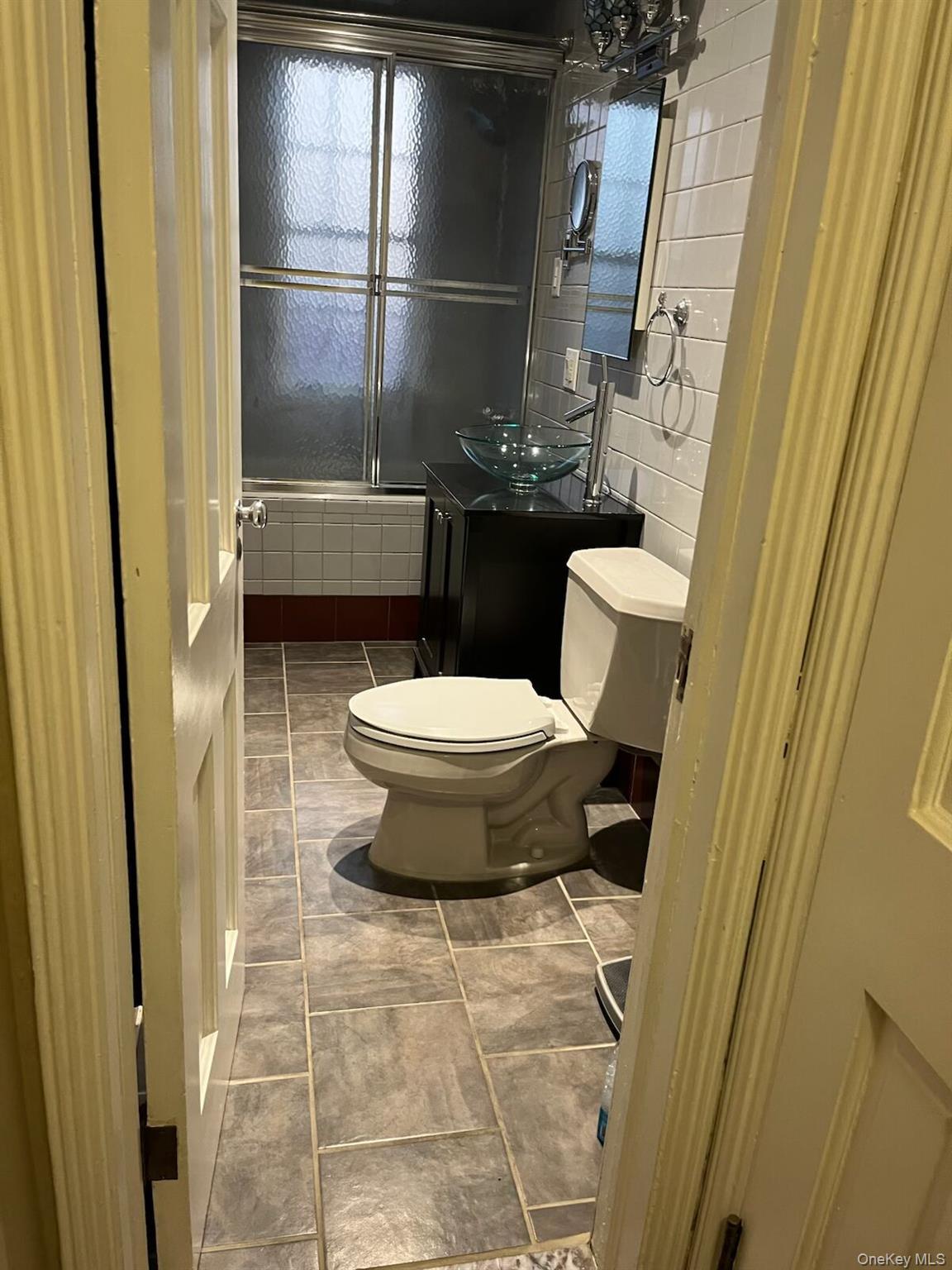 1270 White Plains Road, Unit 2 Bronx, NY 10472 - Photo 4 of 9 a bathroom with a toilet and a shower