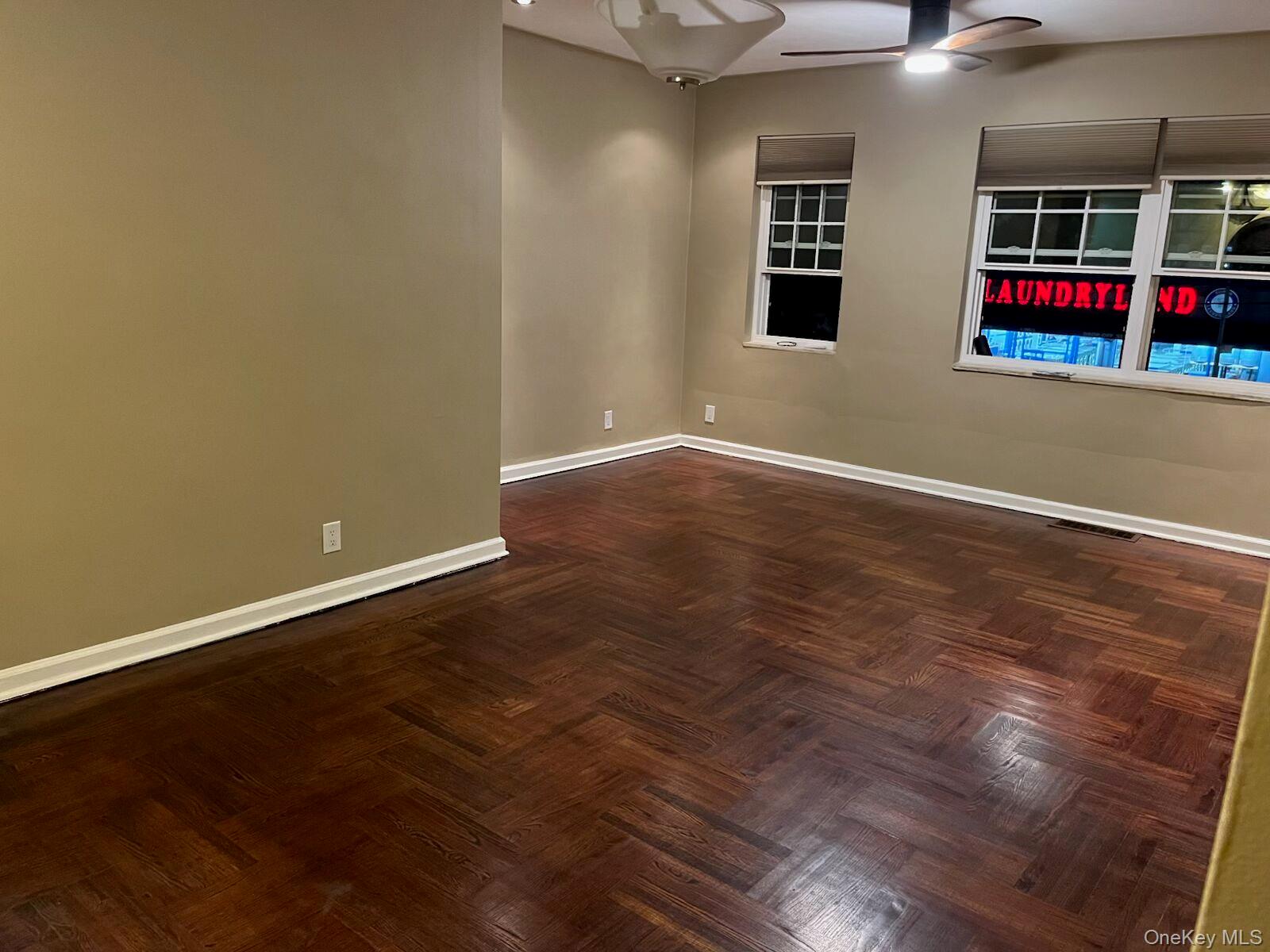 1270 White Plains Road, Unit 2 Bronx, NY 10472 - Photo 7 of 9 an empty room with windows and white walls