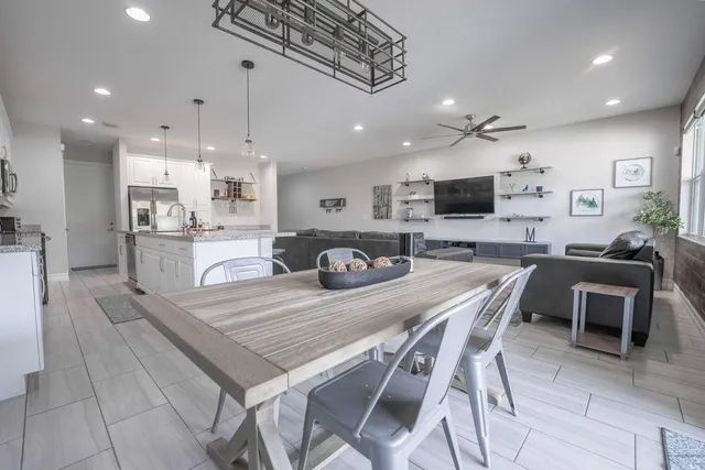 a bedroom with a bed and a television