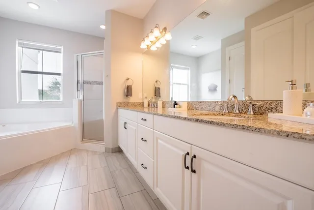 a bedroom with a bed and hallway