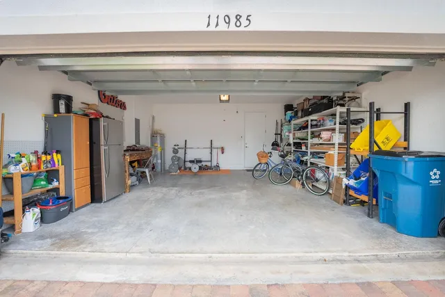a view of a patio with a table chairs and a yard
