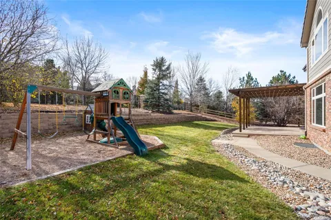 a view of a backyard with a slide and slide