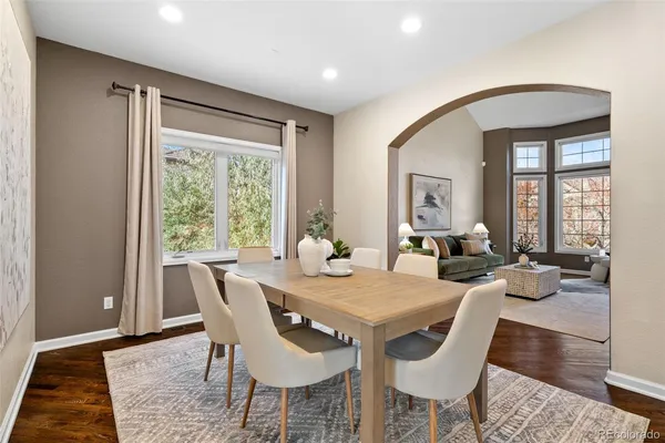 a view of a dining room with furniture window and wooden floor