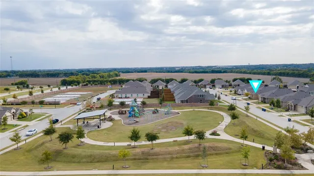 an aerial view of a house with swimming pool
