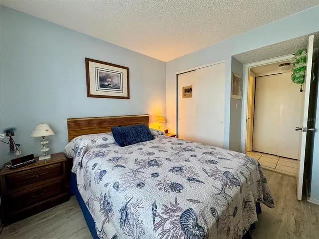 a view of walk in closet with clothes