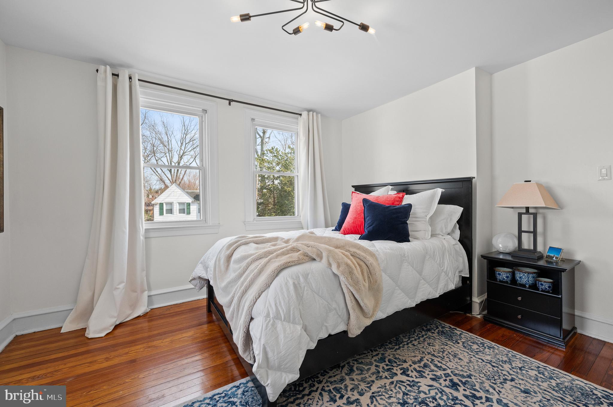 502 Beechwood Lane Narberth, PA 19072 - Photo 15 of 39 a bedroom with a bed and wooden floor