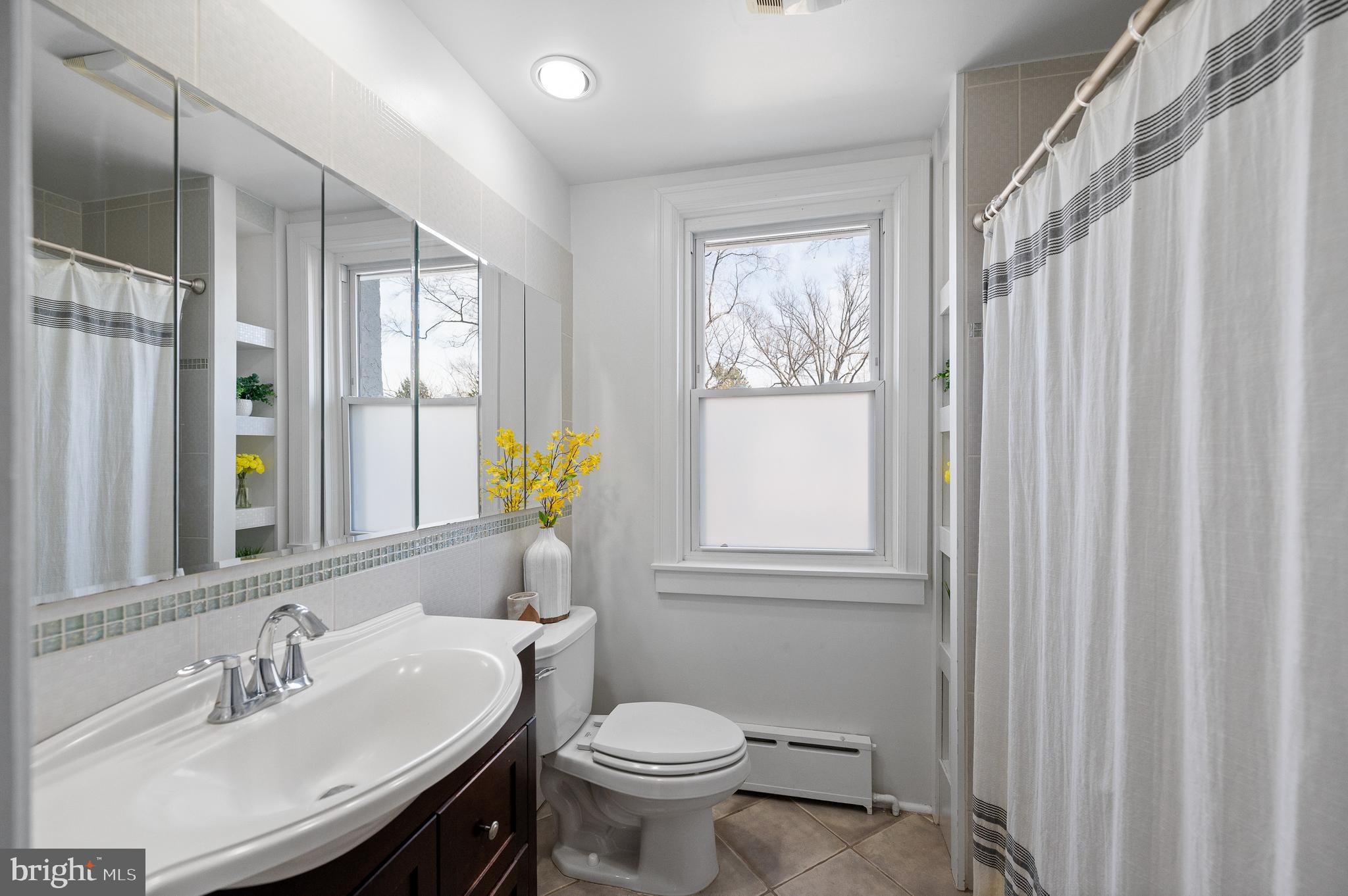 502 Beechwood Lane Narberth, PA 19072 - Photo 21 of 39 a bathroom with a sink a toilet and a mirror