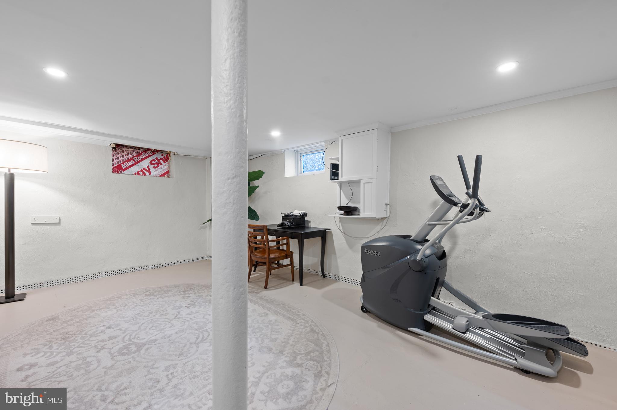 502 Beechwood Lane Narberth, PA 19072 - Photo 24 of 39 a room with gym equipment and a view of living room