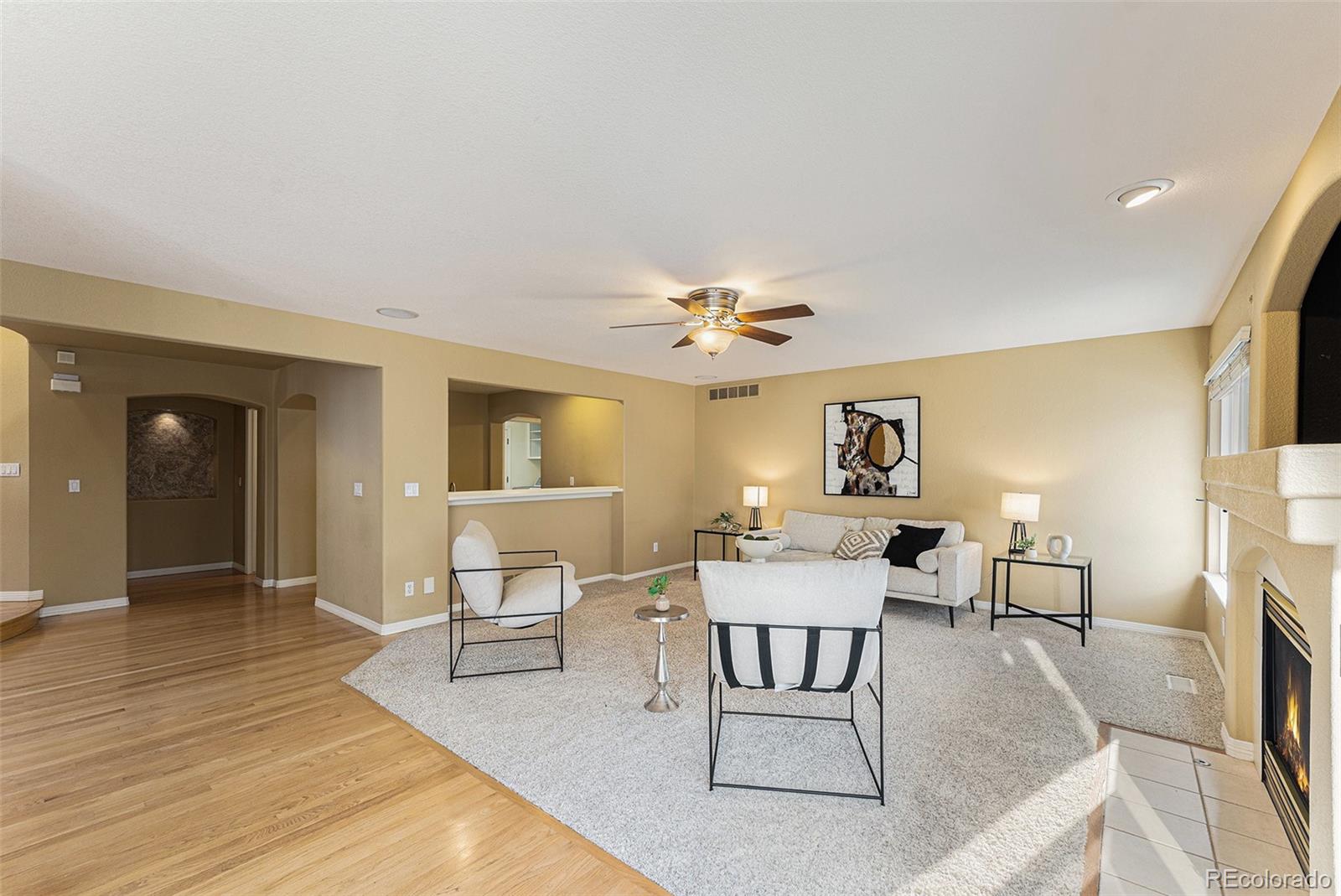 3042 Wyecliff Way Highlands Ranch, CO 80126 - Photo 12 of 40 a living room with furniture and a wooden floor