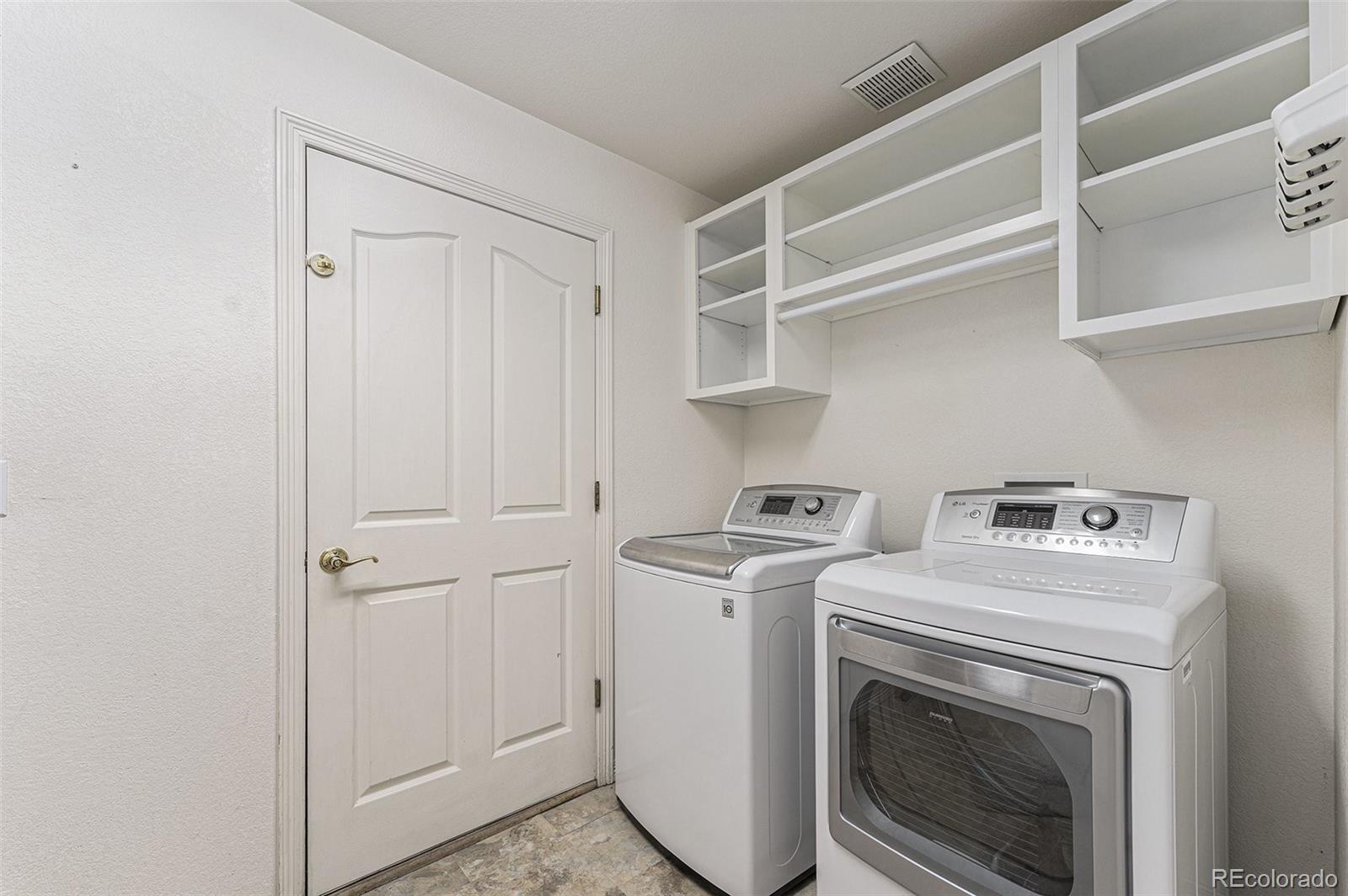 3042 Wyecliff Way Highlands Ranch, CO 80126 - Photo 21 of 40 a utility room with dryer and washer