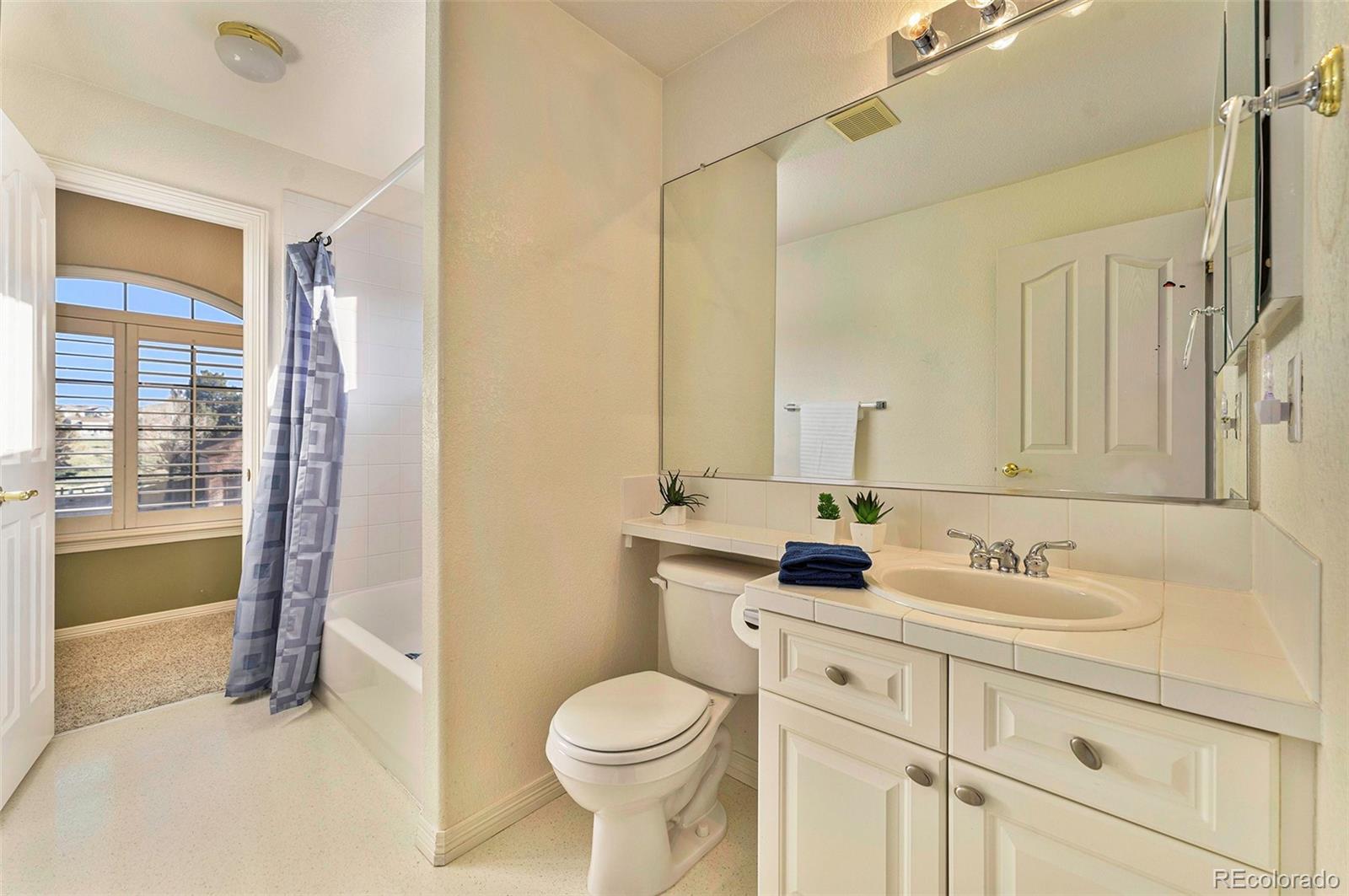 3042 Wyecliff Way Highlands Ranch, CO 80126 - Photo 28 of 40 a bathroom with a sink toilet and shower