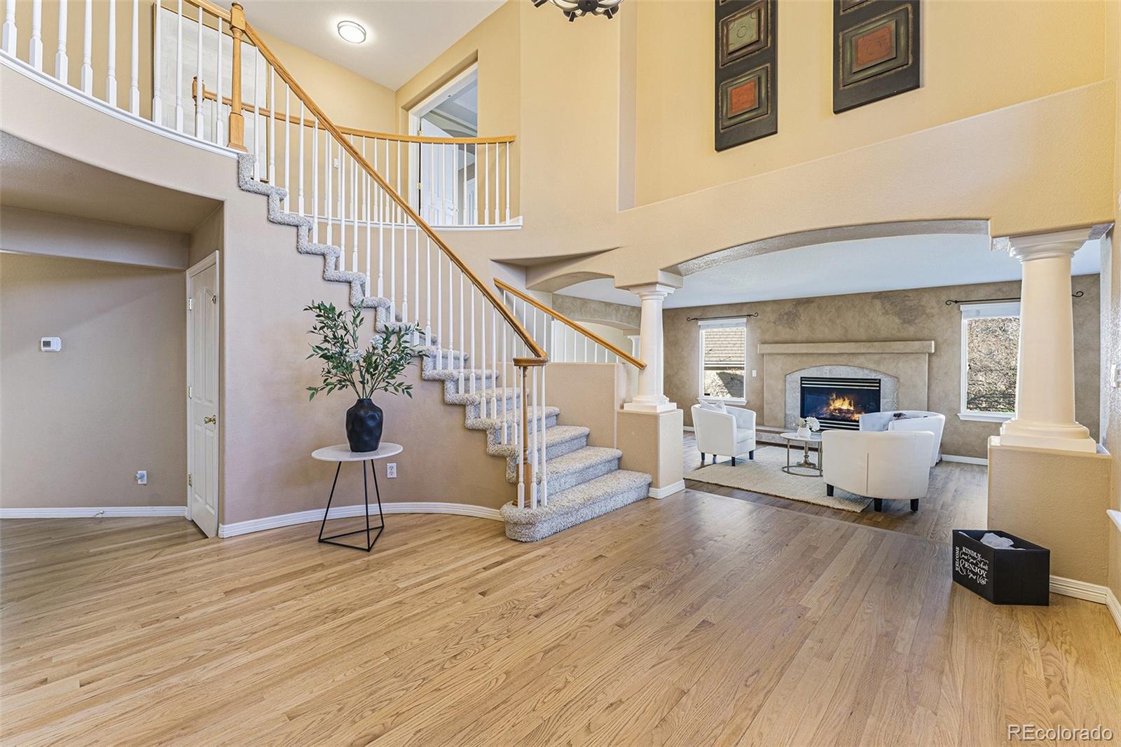 3042 Wyecliff Way Highlands Ranch, CO 80126 - Photo 3 of 40 a living room with furniture and wooden floor