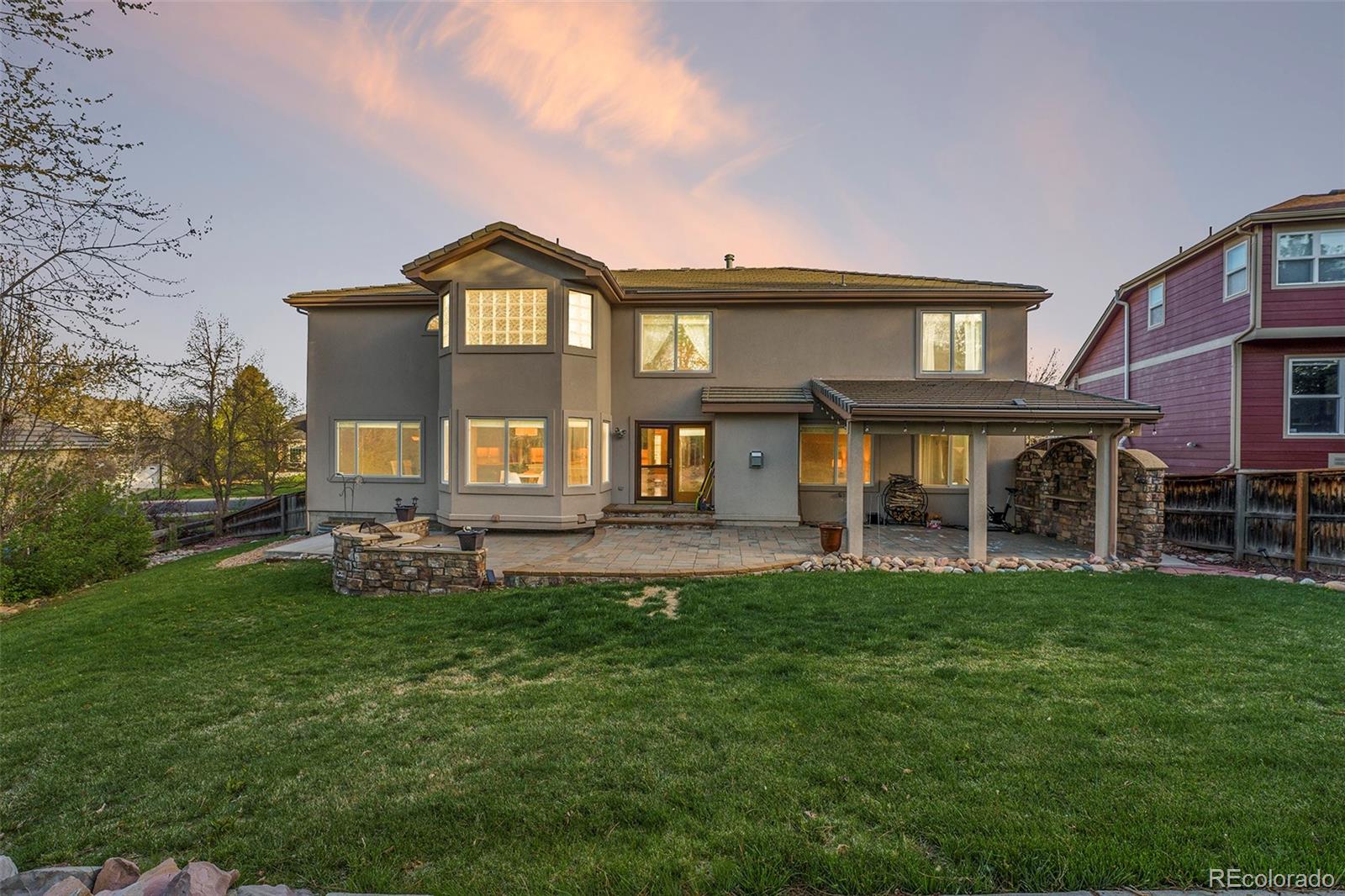 3042 Wyecliff Way Highlands Ranch, CO 80126 - Photo 34 of 40 a view of a house with a big yard and large trees