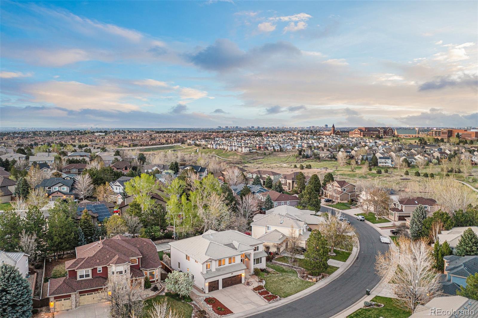 3042 Wyecliff Way Highlands Ranch, CO 80126 - Photo 35 of 40 an aerial view of a house with a lake view
