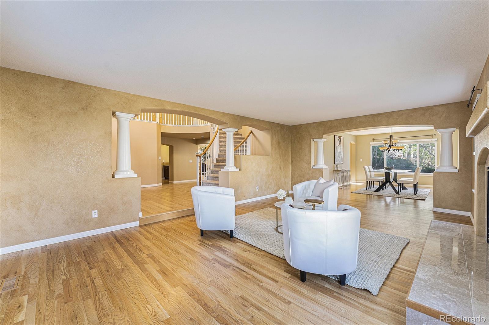 3042 Wyecliff Way Highlands Ranch, CO 80126 - Photo 5 of 40 a living room with furniture and a large window