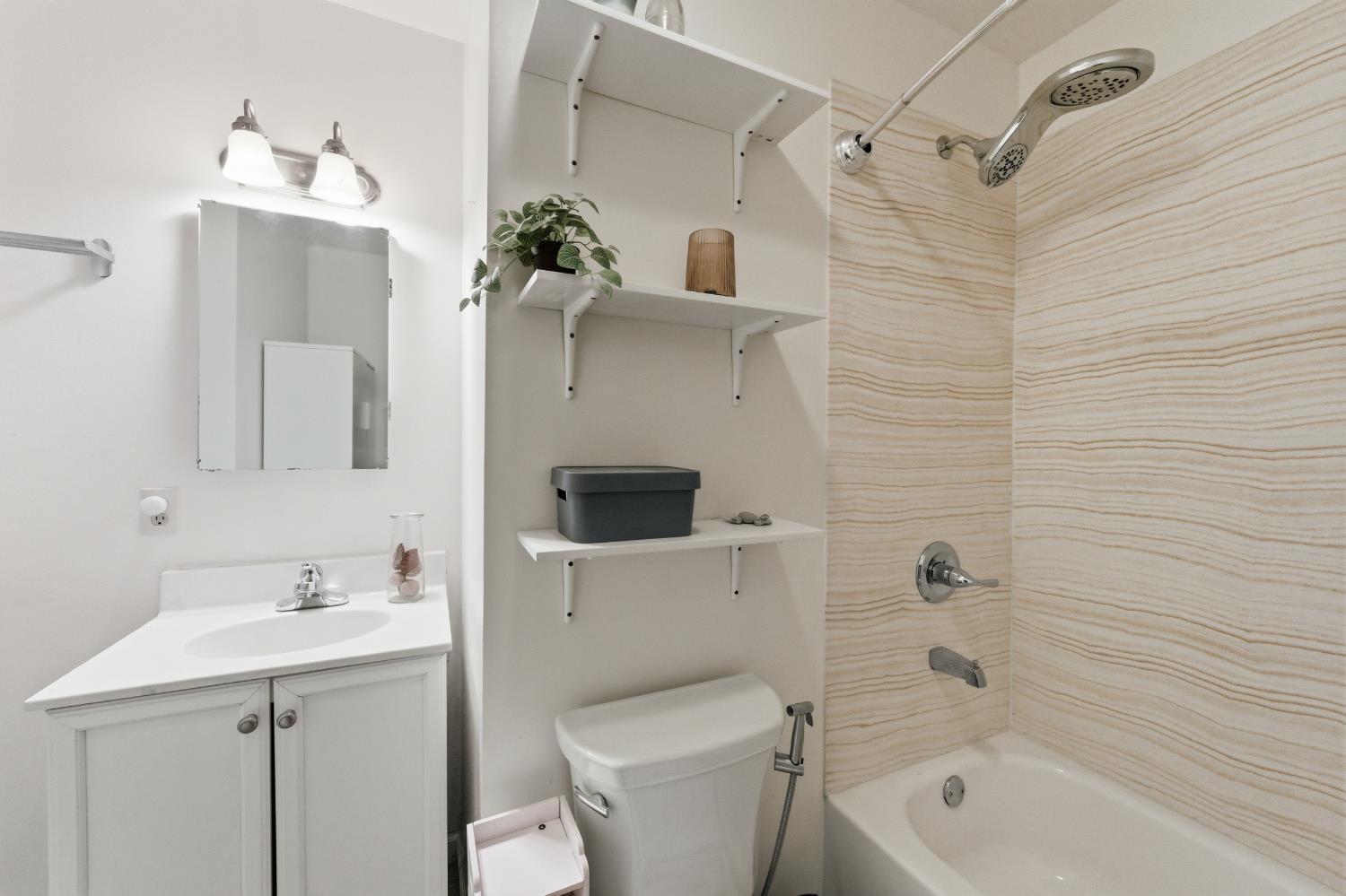 1301 Chestnut Lane Davis, CA 95616 - Photo 24 of 38 a bathroom with a sink a toilet and shower