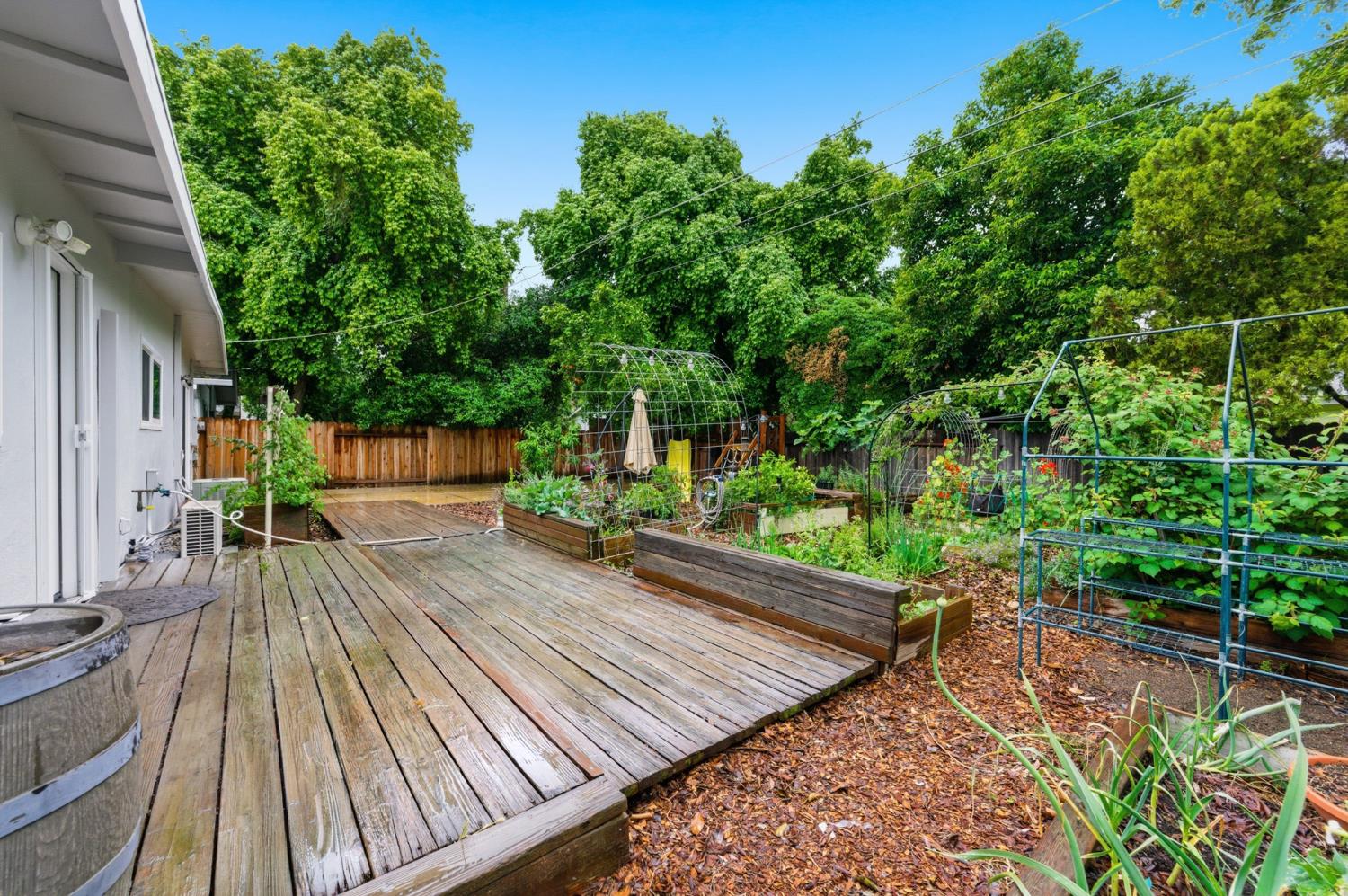 1301 Chestnut Lane Davis, CA 95616 - Photo 32 of 38 a view of a wooden deck with a bench