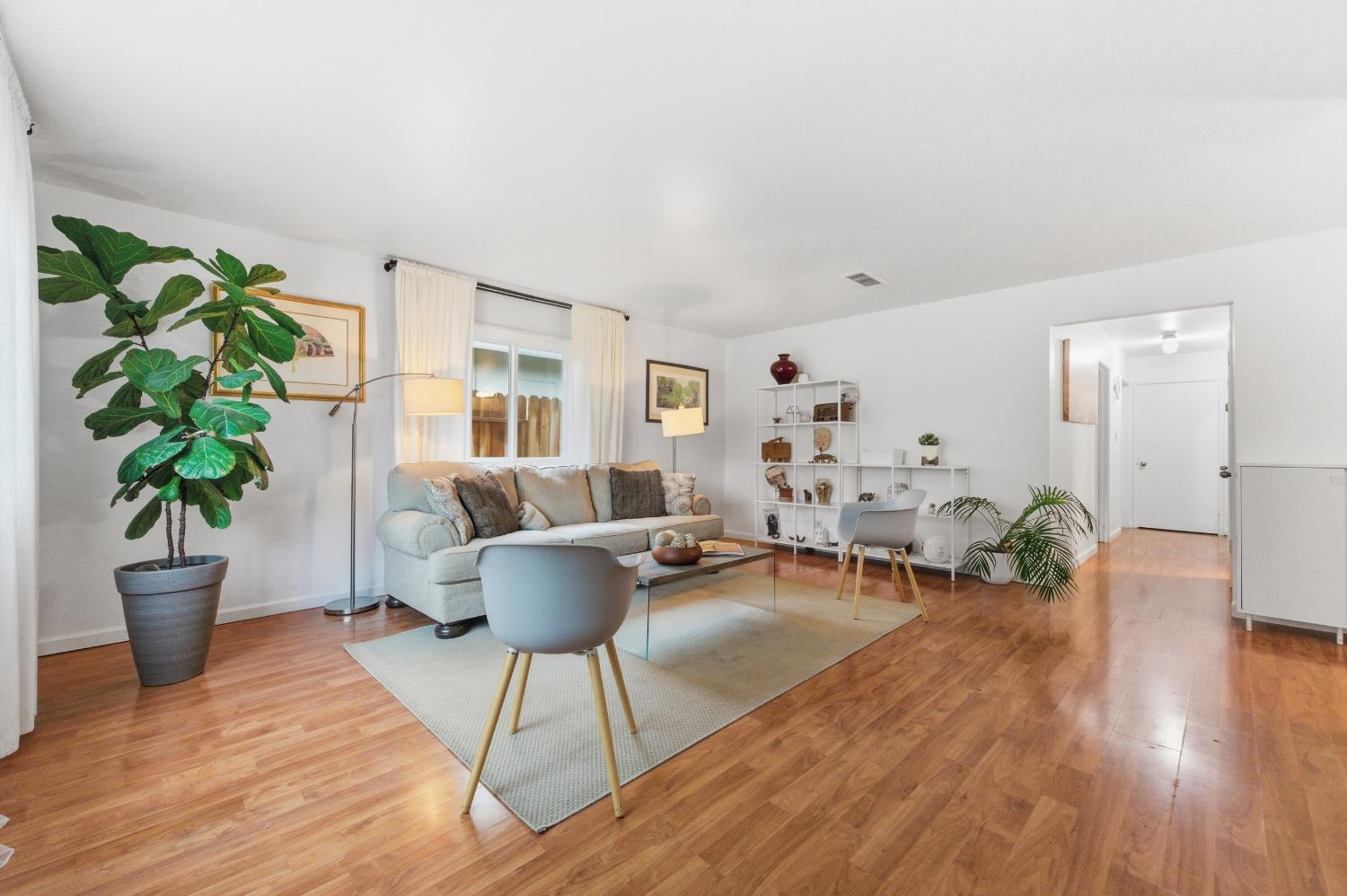 1301 Chestnut Lane Davis, CA 95616 - Photo 6 of 38 a living room with furniture and a potted plant