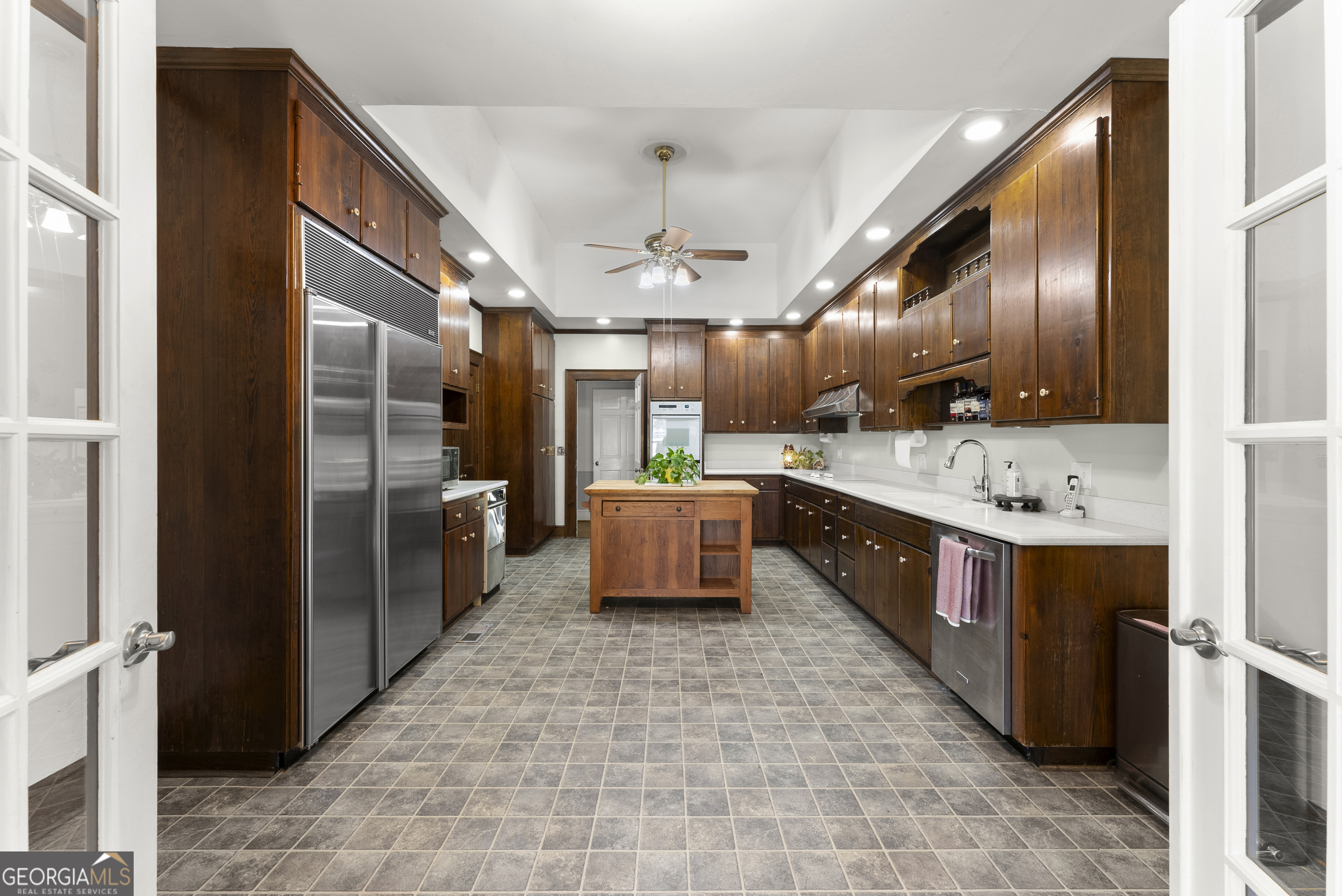 1972 Rest Haven Road Yatesville, GA 31097 - Photo 11 of 52 a large kitchen with stainless steel appliances kitchen island granite countertop a refrigerator and a sink