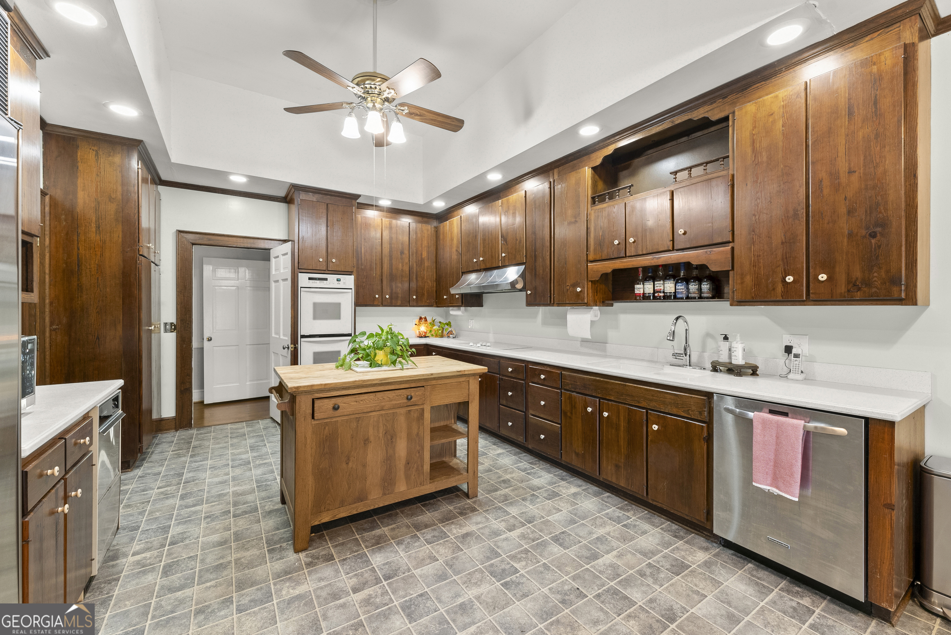 1972 Rest Haven Road Yatesville, GA 31097 - Photo 13 of 52 a kitchen with stainless steel appliances granite countertop wooden cabinets a sink and dishwasher