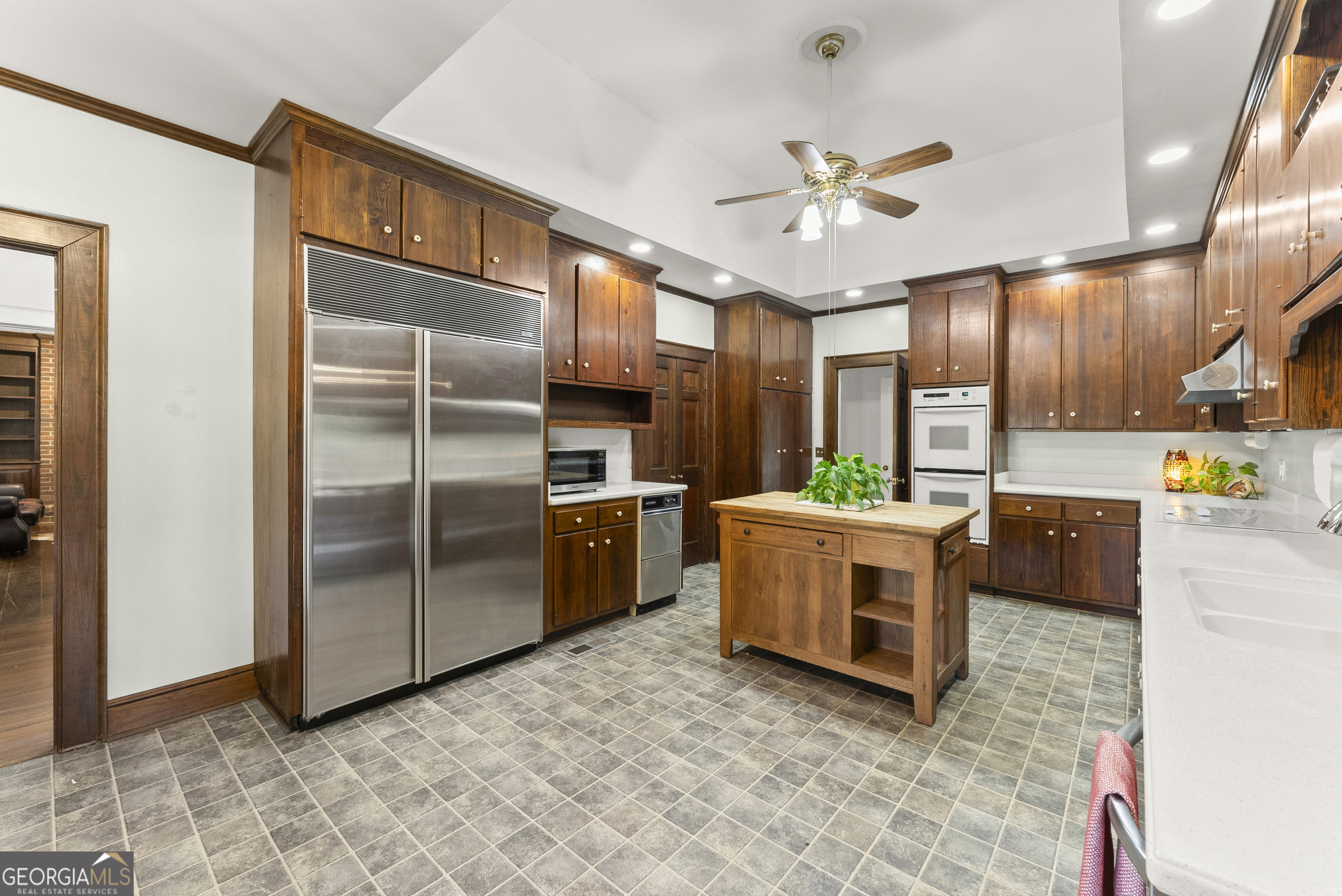 1972 Rest Haven Road Yatesville, GA 31097 - Photo 14 of 52 a kitchen with a refrigerator and a sink