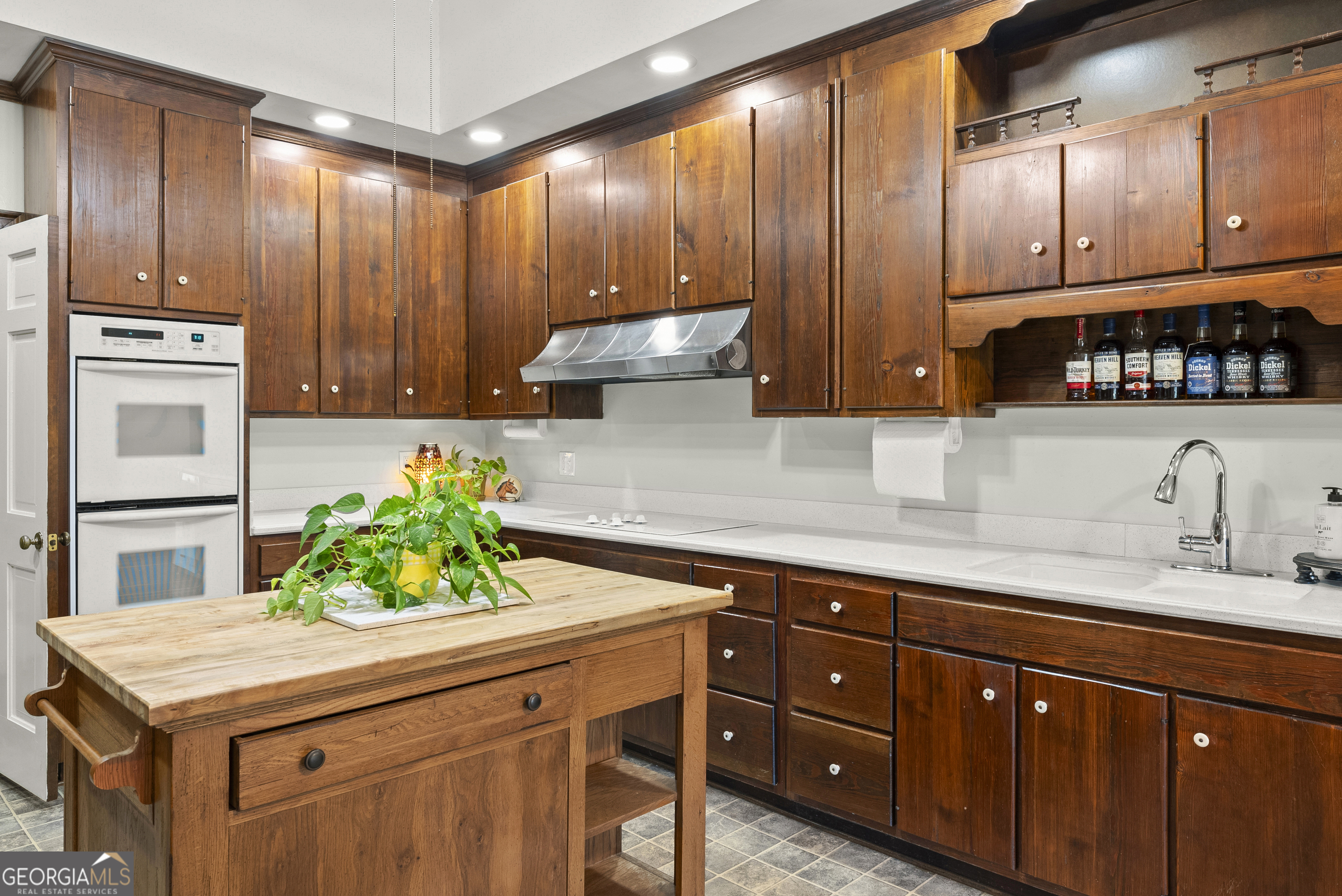 1972 Rest Haven Road Yatesville, GA 31097 - Photo 15 of 52 a kitchen with kitchen island granite countertop wooden cabinets and a stove