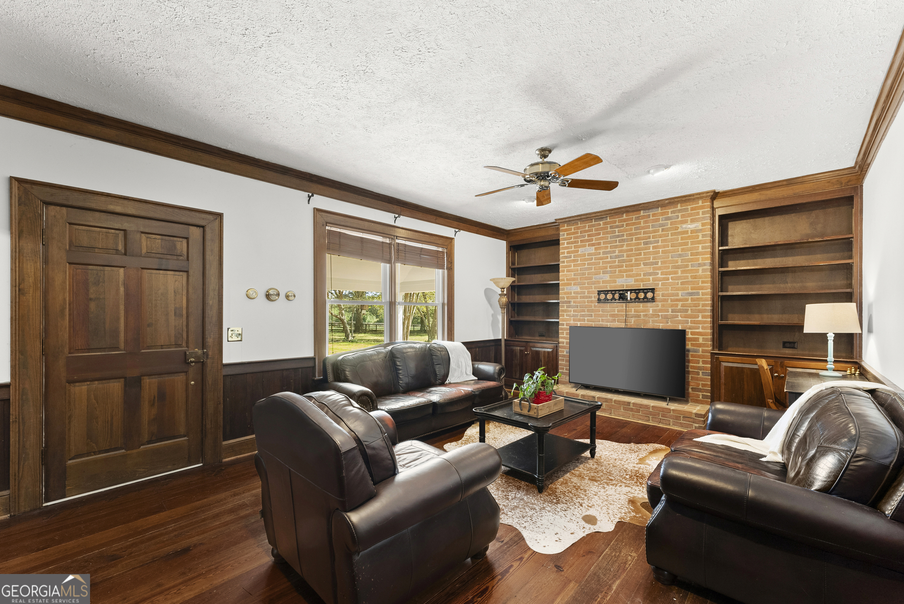 1972 Rest Haven Road Yatesville, GA 31097 - Photo 19 of 52 a living room with furniture a ceiling fan and a window
