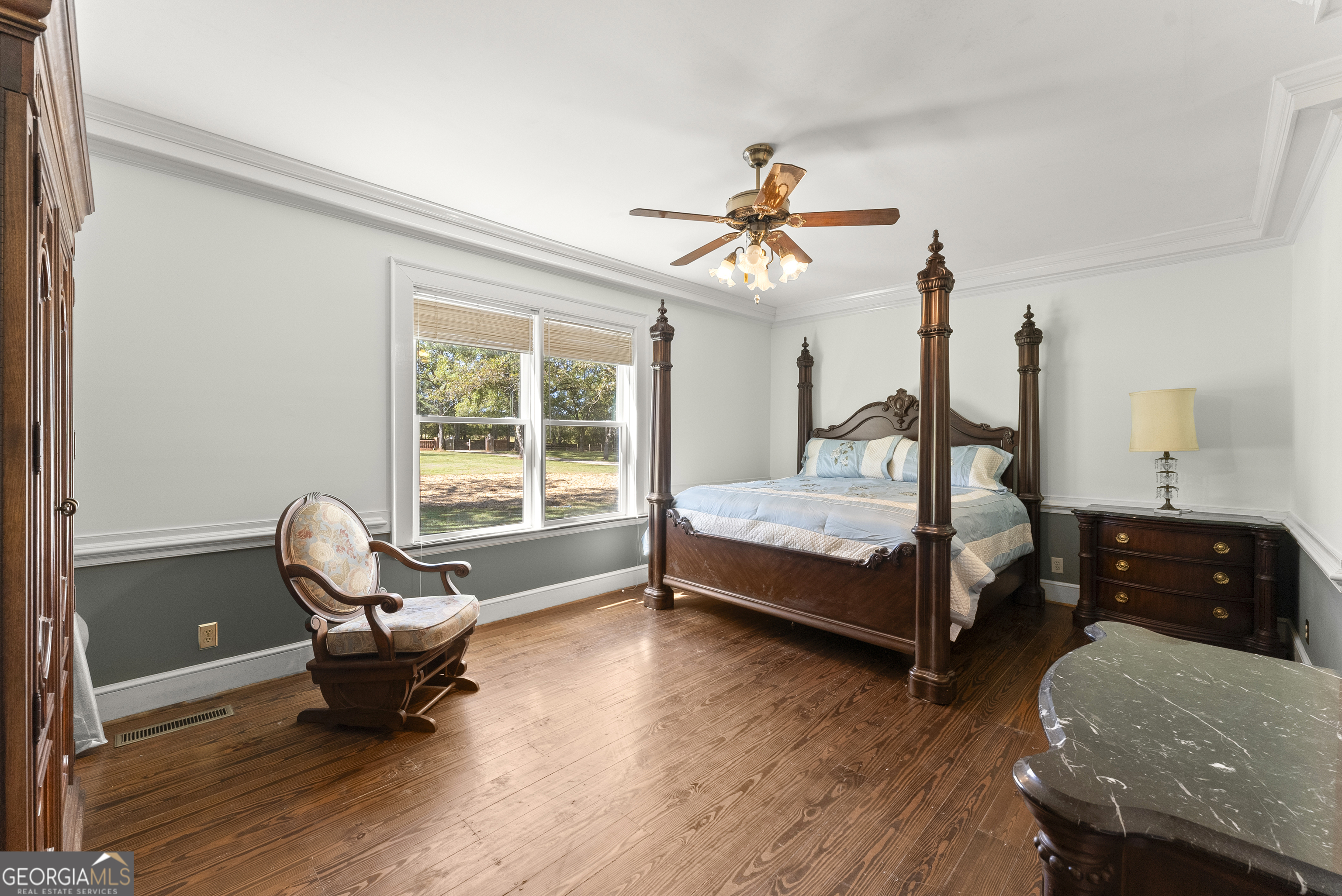 1972 Rest Haven Road Yatesville, GA 31097 - Photo 24 of 52 a bedroom with a bed and wooden floor