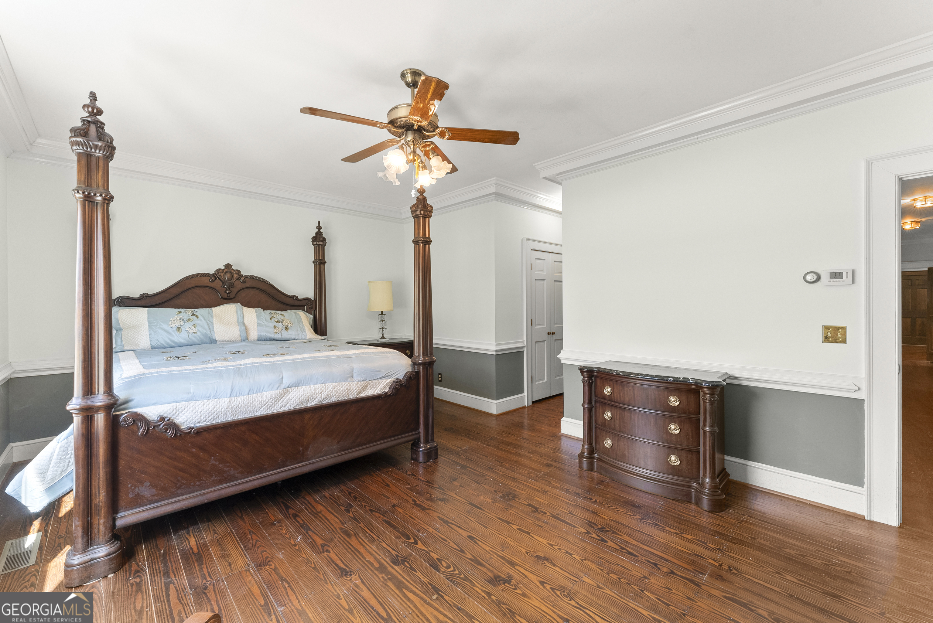 1972 Rest Haven Road Yatesville, GA 31097 - Photo 25 of 52 a bedroom with a bed and a chandelier