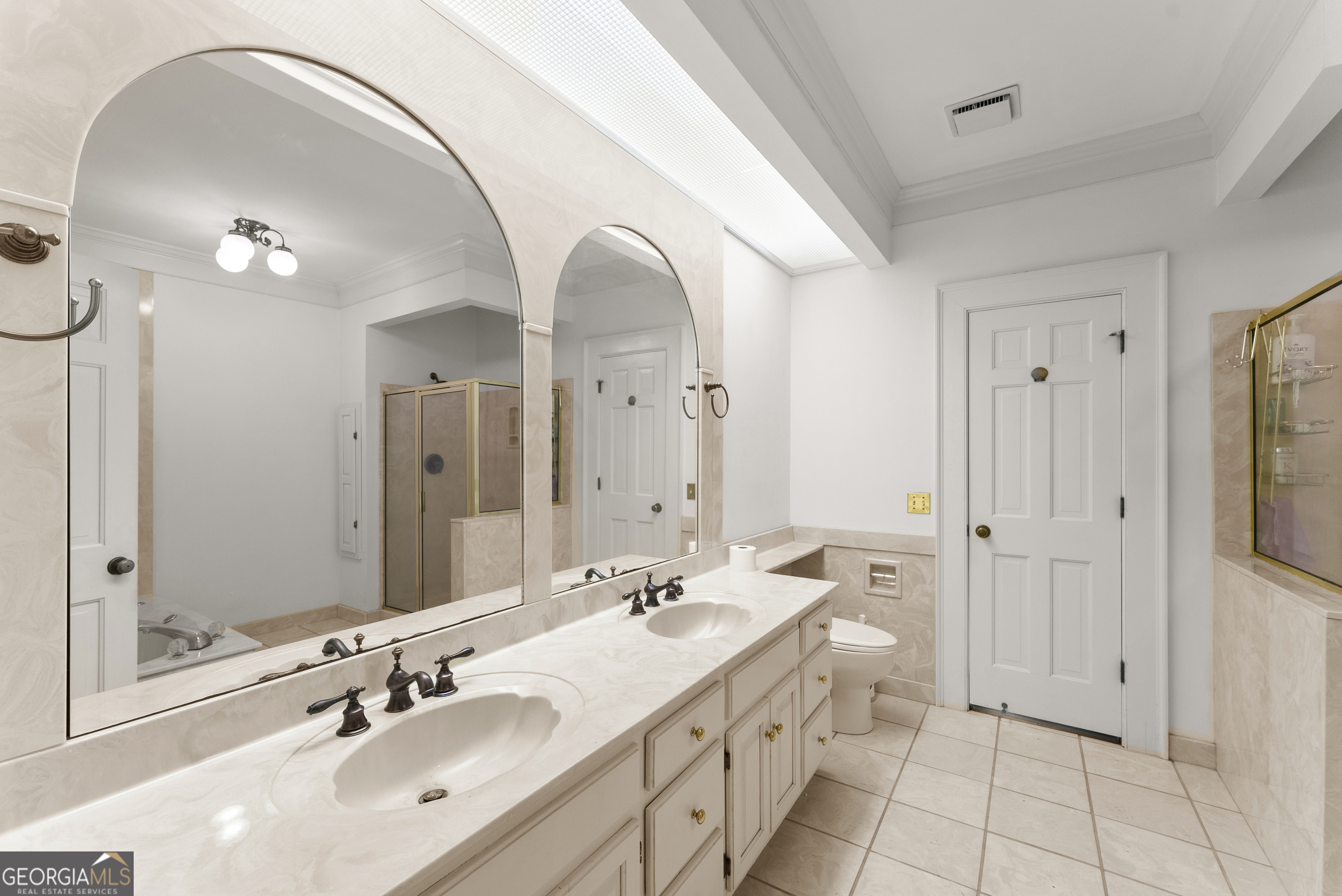 1972 Rest Haven Road Yatesville, GA 31097 - Photo 27 of 52 a spacious bathroom with a double vanity sink a mirror and a shower