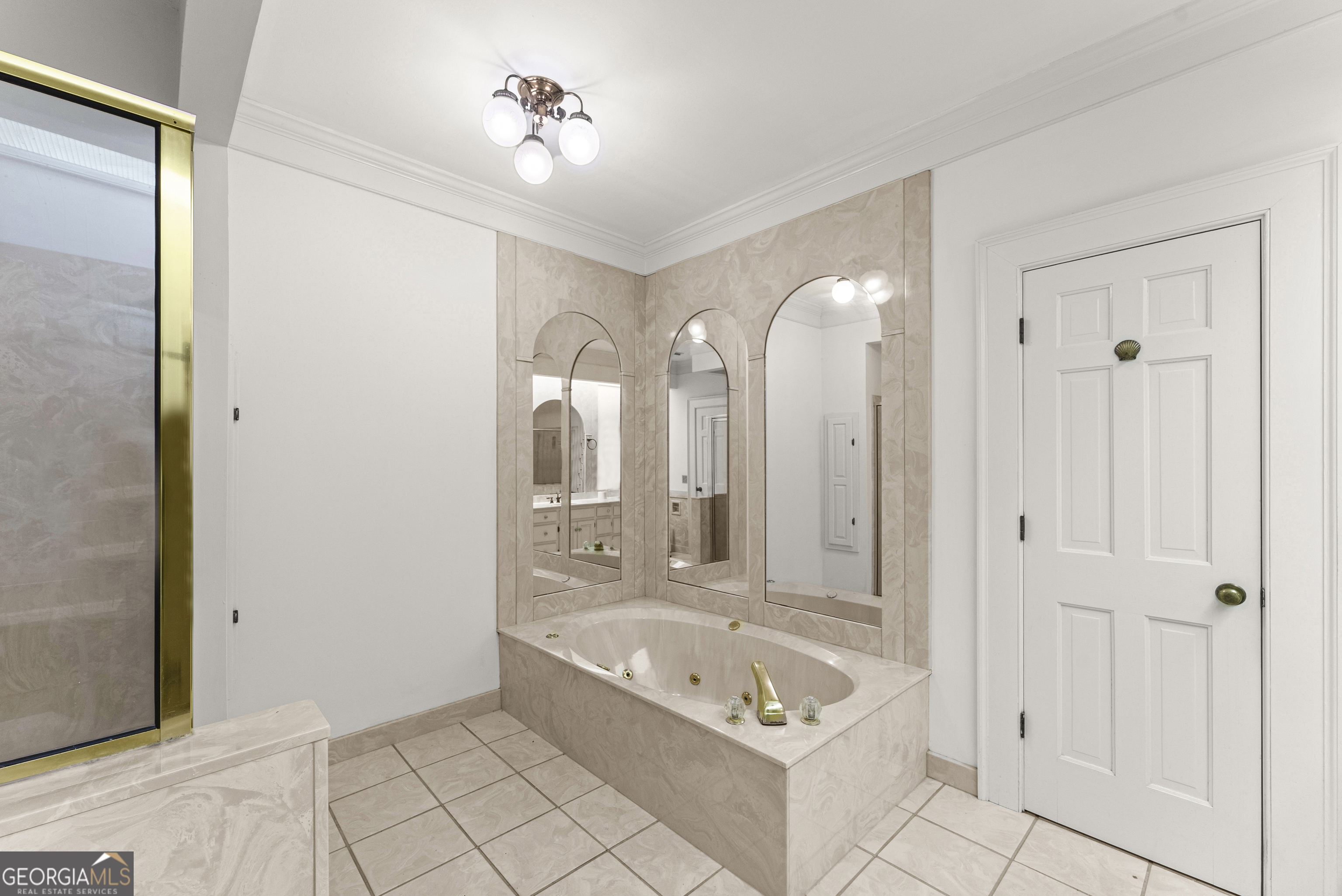 1972 Rest Haven Road Yatesville, GA 31097 - Photo 28 of 52 a spacious bathroom with a tub a sink and a mirror