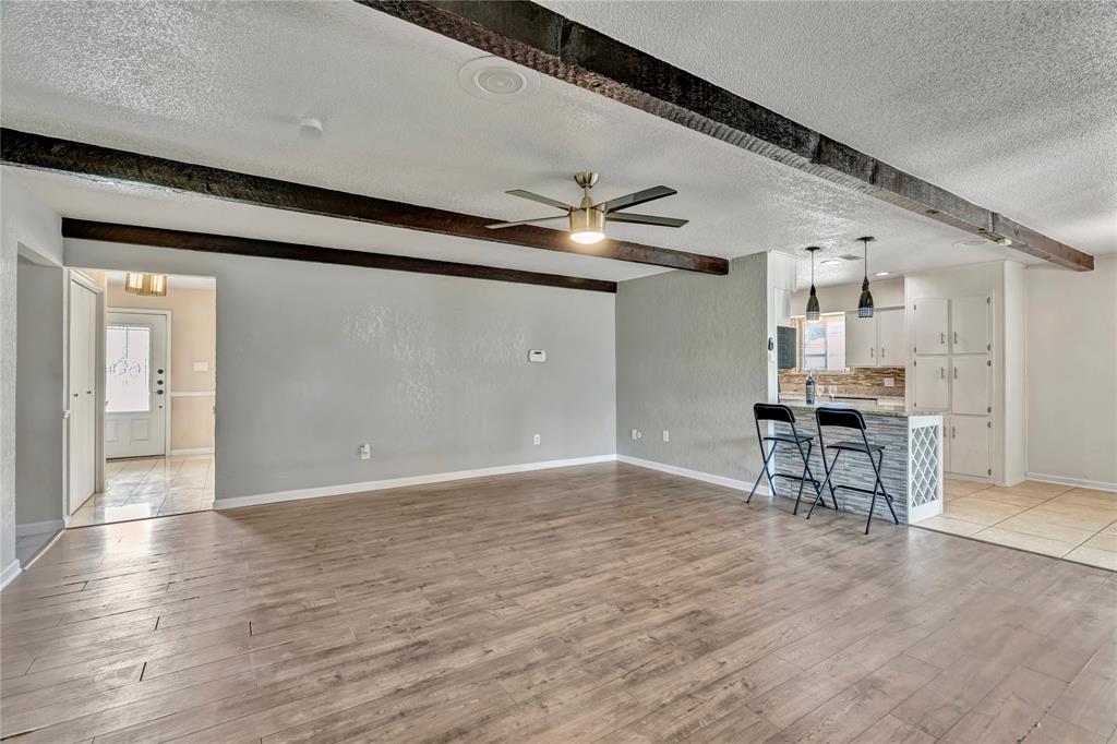4405 Ray White Road Fort Worth, TX 76244 - Photo 11 of 36 a view of a livingroom with furniture and a kitchen