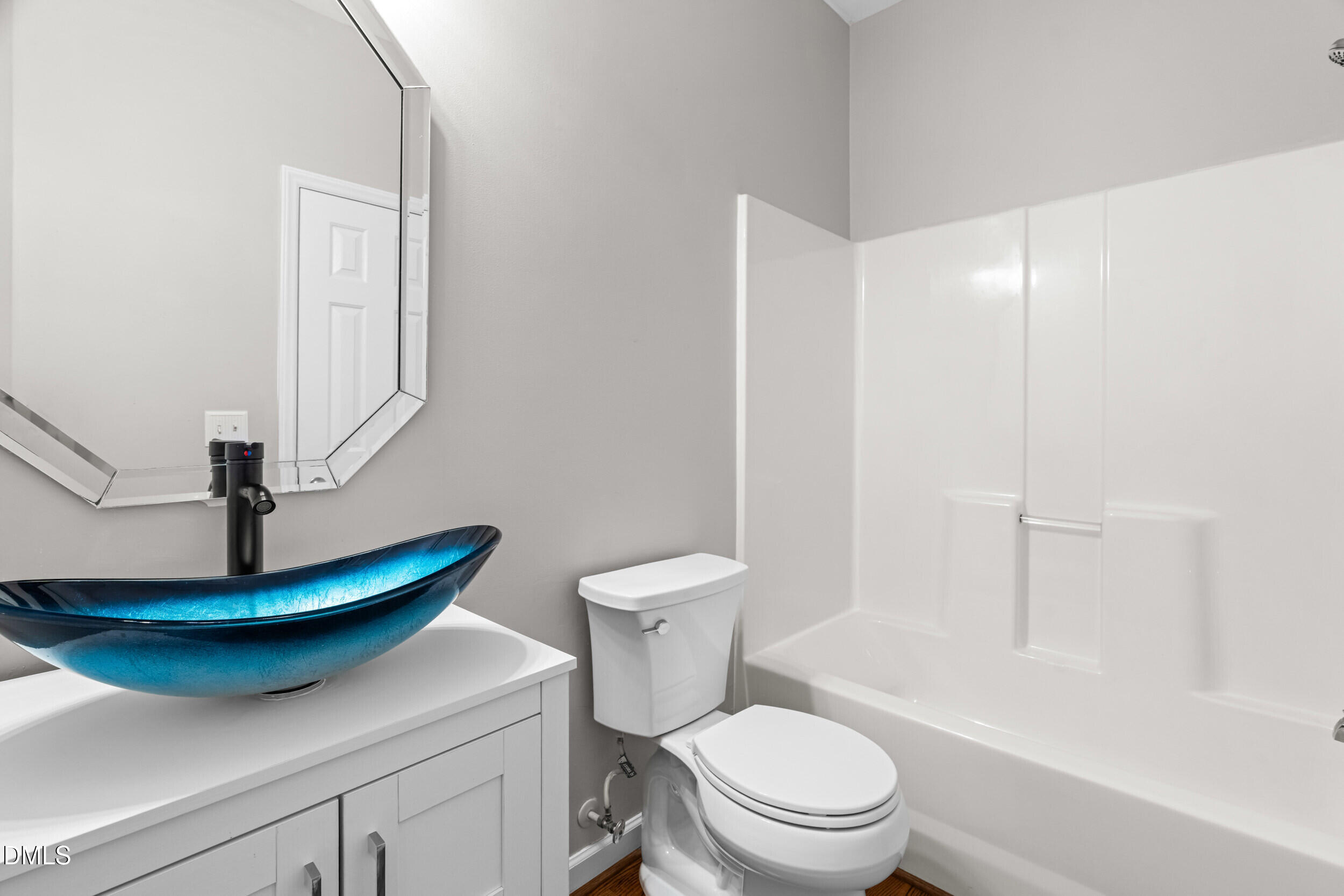 744 Seastone Street Raleigh, NC 27603 - Photo 10 of 53 a bathroom with a toilet a sink and a bathtub