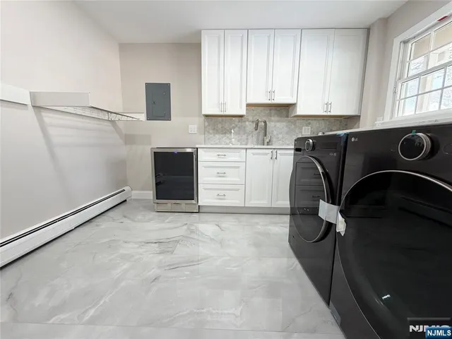 a kitchen with a refrigerator and cabinets