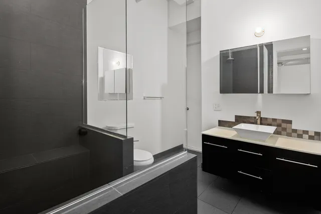 an empty room with wooden floor and a window