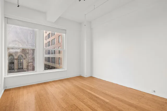 a bathroom with a sink a light fixture and a mirror