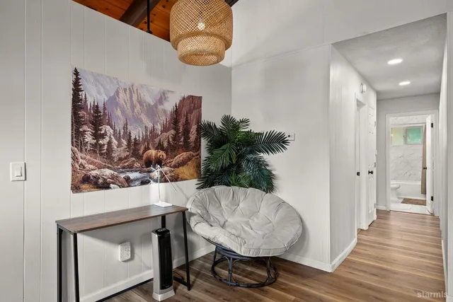 a view of a livingroom with furniture and wooden floor