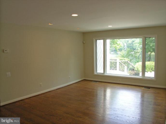2204 Spinnaker Court Reston, VA 20191 - Photo 14 of 20 an empty room with wooden floor and windows