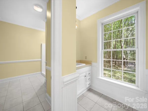 a view of an empty room with a balcony
