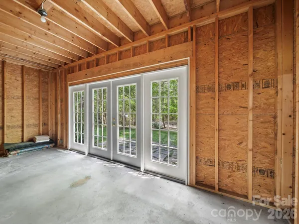 a view of an empty room with windows